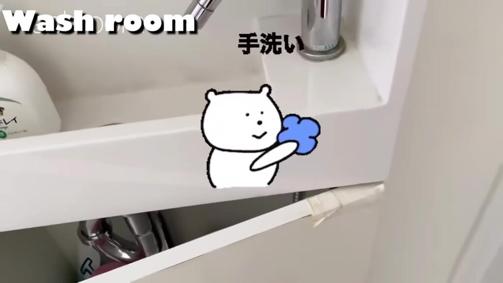 埋め込み手洗いの下の板が割れている様子
